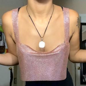 Pink cropped top.